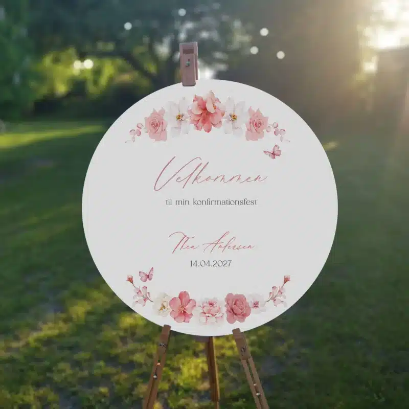 Velkomstskilt til en feminin pige konfirmatin med lyserøde og ferskenfarvede blomster
